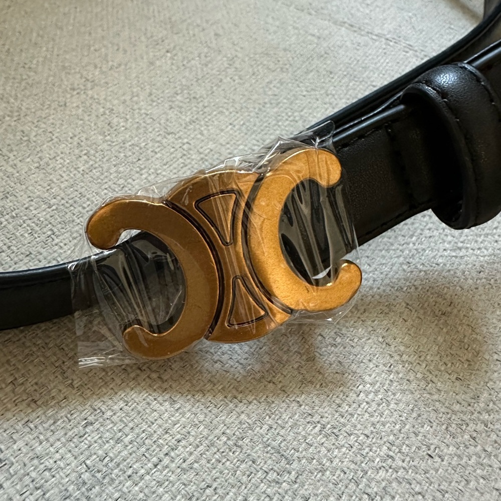 Black fashion belt with gold buckle
